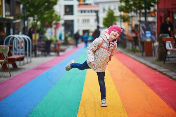 Happy,Adorable,Preschooler,Girl,Having,Fun,On,A,Rainbow,Street